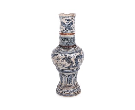 A LARGE VIETNAMESE BLUE AND WHITE CANDLEHOLDER
16th/17th century, hollow waisted body with rounded shoulders, decorated in tw