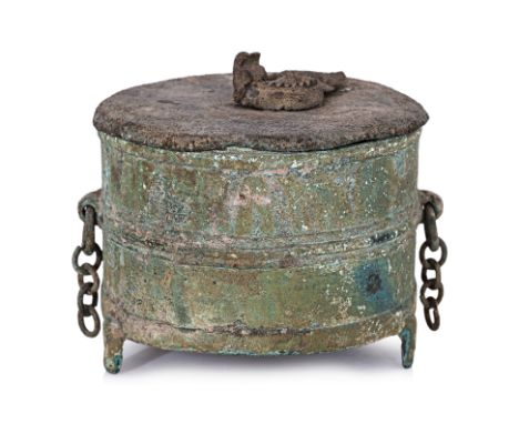 A VIETNAMESE BRONZE JIUZUN WINE WARMER AND COVER
Circa 300BC-100AD, circular tripod jar and cover with strips across sides, r