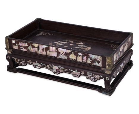 A MOTHER OF PEARL INLAID HARDWOOD TEA TRAY
Rectangular tray with gallery sides, sitting on curled feet and stretcher base, de