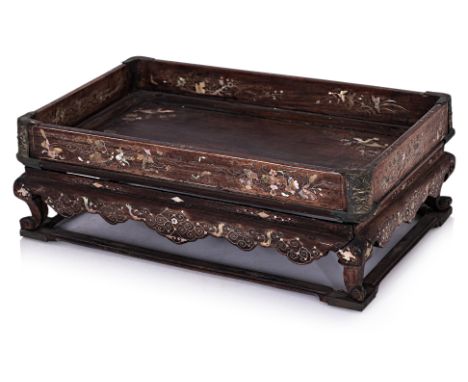 A VIETNAMESE HARDWOOD AND MOTHER OF PEARL SHELL TRAY
Rectangular tray with gallery sides, sitting on curled feet and stretche