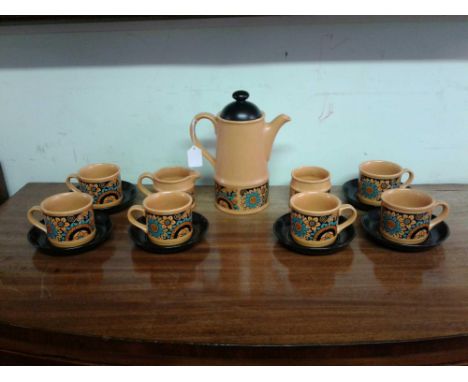 comprising a yellow pottery coffee pot and matching cups with black saucers, 15 pieces 