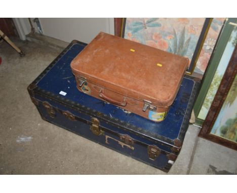 A travelling trunk together with a leather suitcase 