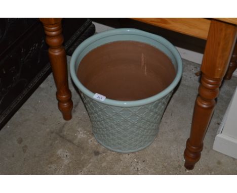 A light green glazed planter