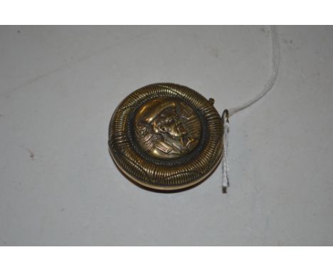 A circular brass snuff box with sailor decoration 