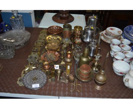 A collection of various brass and copperware including a hunting horn, ink well, horse brasses; and a four piece stainless st