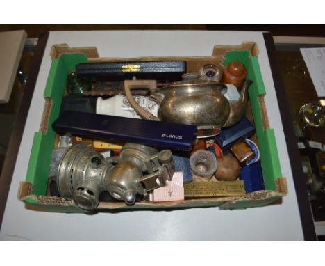 A box containing a silver plated teapot, carbide lamp etc. 