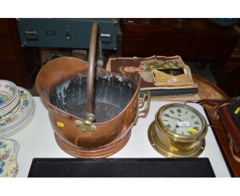 A brass cased bulkhead ship clock and a copper coal scuttle 