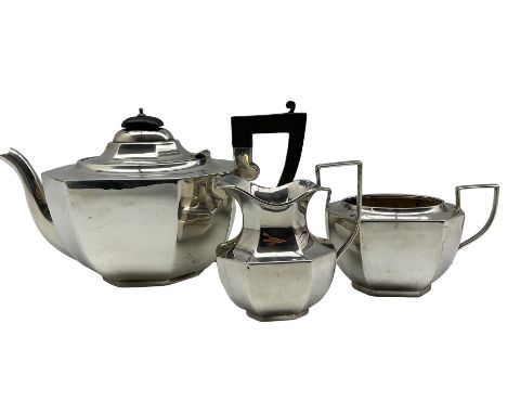 Silver three piece Art Deco tea set of panel sided design, the teapot with ebonised handle and lift Birmingham 1931 Maker Abr