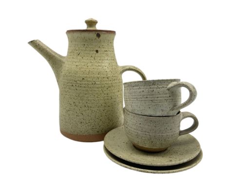 David Lloyd Jones (British 1928-1994): Coffee set comprising coffee pot, two cups and saucers speckled and glazed, max H24cm