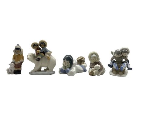 Four Lladro figures comprising 'Eskimo Riders' no. 2270, 'Eskimo Boy with Polar Bear' no. 2269, 'Eskimo playing with polar be