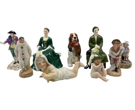 Royal Doulton figure of a spaniel with a pheasant HN1028, Lady and Gentleman from Williamsburg HN2227 and HN2228, Spode Chels