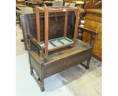 A 20th century oak monk's bench, 98cm wide and a stick stand, (2).