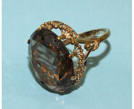 A 9ct gold ring set a large smoky quartz, size M½, 6g.