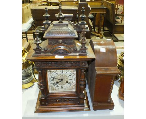 A walnut-cased striking mantel clock of architectural form, the movement marked "Junghans", 55cm high, (a/f) and two other st