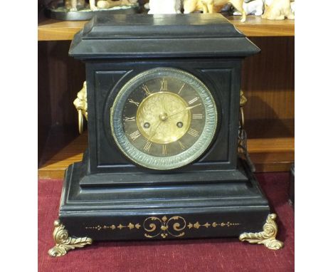 A black slate striking mantel clock by Roblin &amp; Sons, Paris, with gilt metal lion masks, rings and front supports, 31.5cm