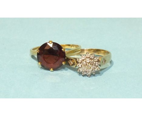 A 9ct gold ring set a cluster of diamond points, size M, 2.2g and an 18ct gold ring claw-set a round-cut garnet, size M, 2.5g