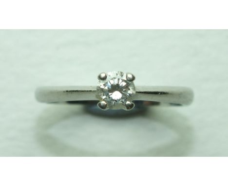 A solitaire diamond ring four-claw-set a brilliant-cut diamond, in platinum mount, size L, 3.8g, with Beaverbrooks diamond ce