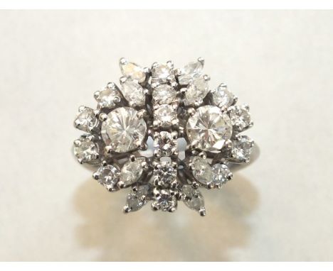 A diamond cluster ring claw-set twenty-four brilliant and marquise-cut diamonds, in 18ct white gold mount, size N, 5.8g.