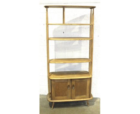 An Ercol light elm 'Giraffe' room divider fitted with three shelves, (two adjustable), above a pair of cupboard doors, 190cm 