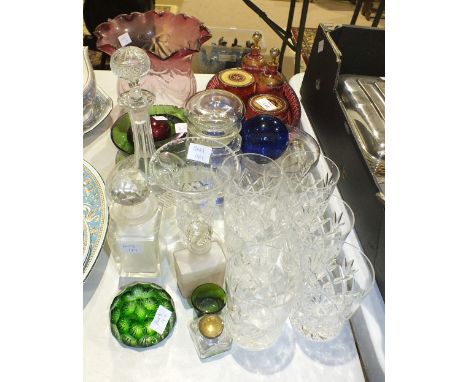 A four-piece cranberry glass dressing table set, on oval tray with white enamel and gilt decoration, a cranberry and clear gl