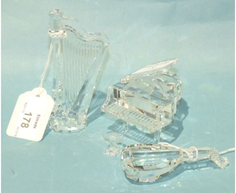 A Swarovski crystal glass model of a grand piano, 7cm high, 6.5cm wide, with stool, a lute and a harp, all boxed, (3).