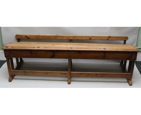 AN EARLY 20TH CENTURY PINE SCHOOL DESK AND SEAT COMBINATION FOR FOUR CHILDREN, with pen holders, inkwell receptacles and four