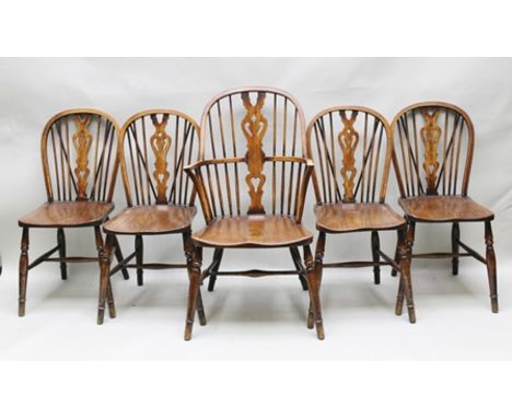 A SET OF FIVE PROVINCIAL DINING CHAIRS, having stick and pierced splat backs, elm seats, on turned supports with H-stretchers