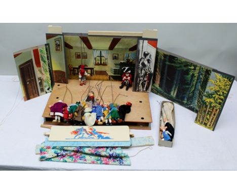 A MID 20TH CENTURY CZECHOSLOVAKIAN PUPPET THEATRE, complete with stage, having reversible back drops, cottage interior, castl