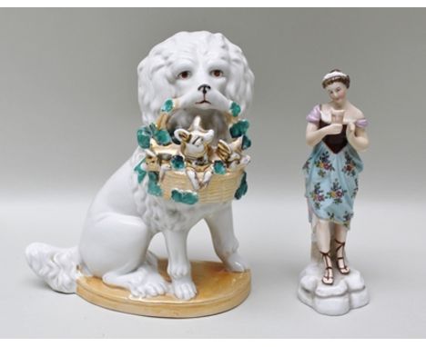 TWO LATE 19TH CENTURY CERAMIC ITEMS, one being a seated dog with a basket of puppies, 19.5cm high, the other a young woman ho