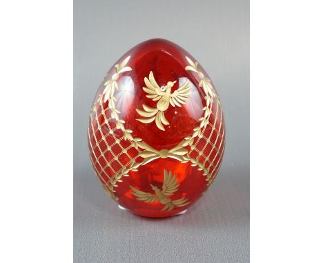 A Russian Motiven hand cut and parcel gilt ruby glass egg, 10 cm