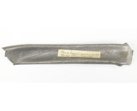 A fragment of duralumin spar from the wreck of Zeppelin LZ 85, bearing a paper label inscribed "Piece of Zeppelin shot down i