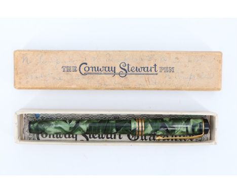 A vintage boxed Conway Stewart 388 fountain pen, having a green marbled body with lever fill and a 14 ct gold nib