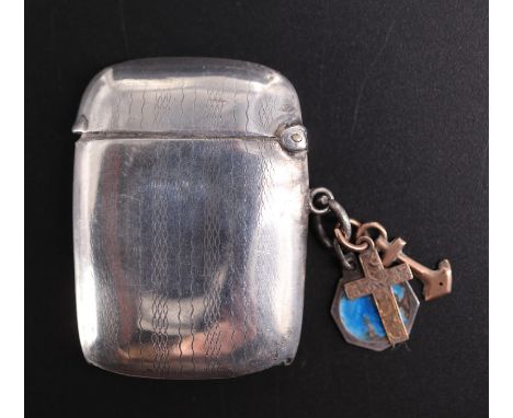 A 1920s silver watch chain fob vesta case, decorated with banded engine turning centred by a vacant circular cartouche, 4.5 c