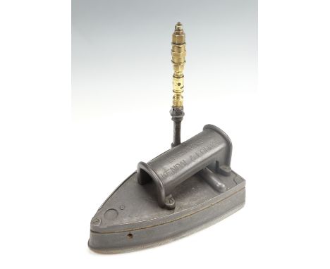 A vintage 'Ibis Patent No 460' gas heated cast iron carpet iron by 'Isaac Braithwaite and Son, Engineers, Kendal and London',