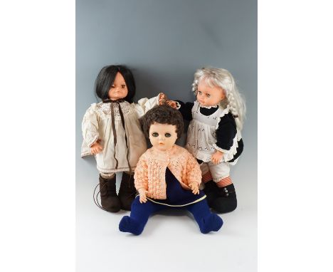 A large vintage composition doll, having sleeping eyes and open mouth, together with two similar plush body dolls, former 59 