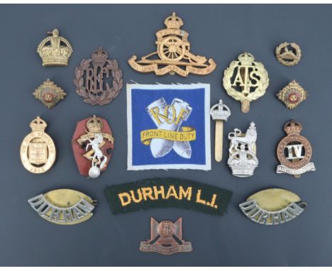 A small group of cap and other badges including a Royal Ordnance Factory printed badge, (some a/f)