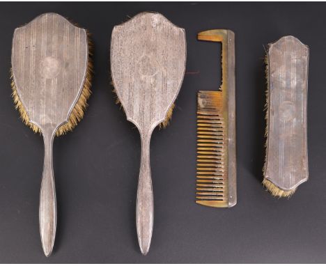 A 1930s silver-backed dressing table brush set, bearing engine turned decoration, (a/f)