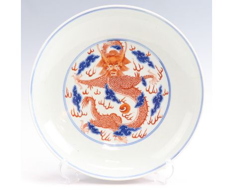 A fine Chinese porcelain dragon pattern dish, in iron-red and underglaze blue, Qianlong seal mark, 25 cm