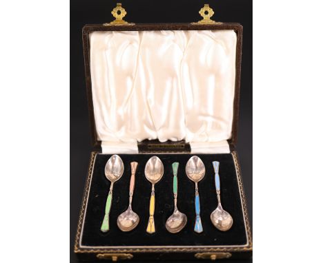 A cased set of six 1950s champlevé harlequin enamelled silver coffee spoons, having enamel decorating the stems front and ver