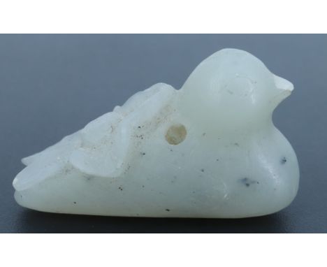 A Chinese carved jade pendant or toggle in the form of a duck and blossom, 32 mm