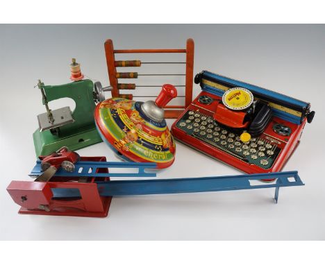 A group of vintage children's toys, including a Mettype typewriter, a Chad Valley tinplate "Choral Top" spinning top, a Littl