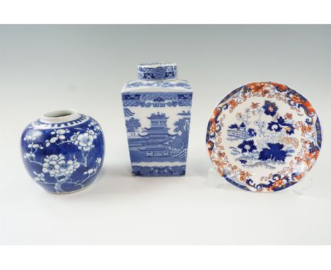 A Rington's blue and white tea caddy together with a Prunus pattern ginger jar and an Amherst dish