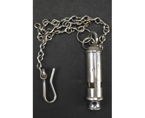 A 1944 British military broad arrow marked Beaufort type whistle together with chain