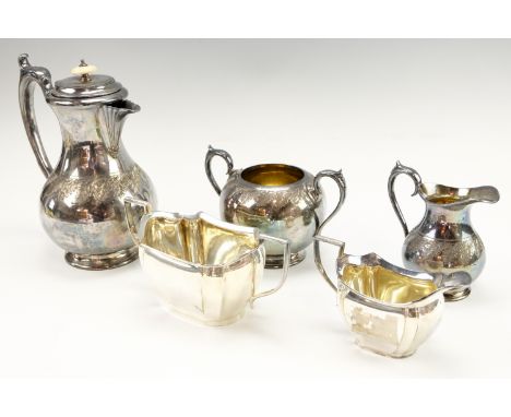 An early 20th Century three piece electroplated Britannia metal coffee set, having engraved oak leaf decoration, gilt interio