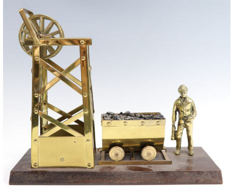 A 1980s brass model of a pit head mining scene, 33 cm x 12 cm x 28 cm 