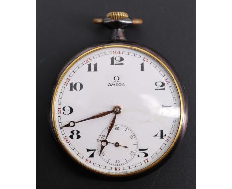 A 1920s Omega "gun metal" pocket watch, having a crown wound 15 jewel movement and 24 hour dial with Arabic numerals and gilt