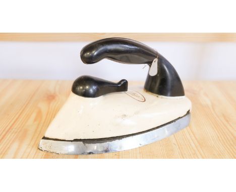 A vintage enamelled cast iron 'Aga' iron, having a detachable base