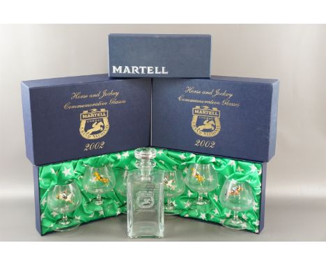 A boxed Martell Cognac decanter together with two boxed sets of Martell Grand National 2002 glasses