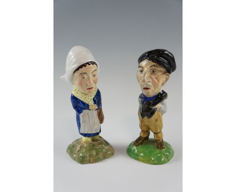 A pair of Clarice Cliff ceramic figures of a Dutch couple modelled by Wilkinson Ltd, 1920s, (lady a/f), 20 cm 