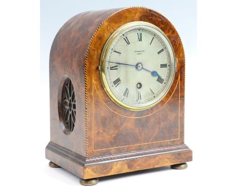 An early 20th Century burr walnut veneered mantle clock, retailed by Spiridion &amp; Son of Cardiff, drum movement marked "G 